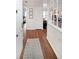 Inviting hallway with hardwood floors, white trim, and a view into the living area, showcasing the home's layout at 1800 Clairmont Lk # A427, Decatur, GA 30033