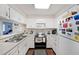 Efficient kitchen with white cabinets and stainless steel appliances, maximizing space and functionality for everyday cooking at 1800 Clairmont Lk # A427, Decatur, GA 30033