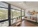 Bright sun room with large windows and wood-look flooring, perfect for relaxation at 1800 Clairmont Lk # A427, Decatur, GA 30033
