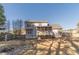 Fenced backyard with a fire pit, storage shed and a screened-in porch at 241 Rockingham Dr, Loganville, GA 30052