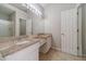 Bathroom featuring double vanity with granite countertop and tile floor at 241 Rockingham Dr, Loganville, GA 30052