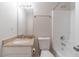 Bathroom featuring granite countertop, single sink, and a shower-tub combo at 241 Rockingham Dr, Loganville, GA 30052