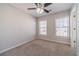 Bedroom with carpet, two windows and a ceiling fan at 241 Rockingham Dr, Loganville, GA 30052