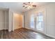 Bright dining area features wood-look floors, closet, and white french doors leading to the exterior at 241 Rockingham Dr, Loganville, GA 30052