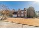 Beautiful two-story brick home with a well-kept lawn and an attached garage at 241 Rockingham Dr, Loganville, GA 30052