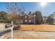 Charming two-story brick home with a well-manicured front yard and a mailbox at 241 Rockingham Dr, Loganville, GA 30052