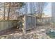 Backyard storage shed near a wooden fence at 241 Rockingham Dr, Loganville, GA 30052