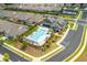 Aerial view of the community pool and clubhouse, surrounded by homes and landscaped grounds at 437 Great Pine Way, Woodstock, GA 30188