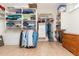 Spacious walk-in closet featuring custom shelving, hanging racks and a chest of drawers at 437 Great Pine Way, Woodstock, GA 30188
