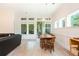 Bright dining area offers natural light and views, seamlessly connected to an outdoor space at 437 Great Pine Way, Woodstock, GA 30188