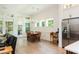 Dining area featuring a chandelier, large windows and doors leading to an outdoor area at 437 Great Pine Way, Woodstock, GA 30188