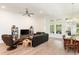 Open-concept living and dining area features hardwood floors and large windows for natural light at 437 Great Pine Way, Woodstock, GA 30188