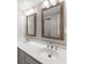 Bright bathroom featuring double sinks, framed mirrors, and modern vanity lighting at 67 25Th Nw St # 5, Atlanta, GA 30309