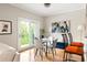 Dining room featuring a glass table, chairs, and sliding glass doors to the outside at 67 25Th Nw St # 5, Atlanta, GA 30309