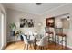 Dining area with glass table, chairs, and view to the kitchen and outdoor area at 67 25Th Nw St # 5, Atlanta, GA 30309