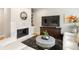 Bright living room with a fireplace, modern furnishings, and hardwood floors at 67 25Th Nw St # 5, Atlanta, GA 30309