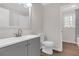 Bright bathroom includes a vanity, toilet, and a tub shower featuring a neutral color palette at 1143 Cedar Log, Austell, GA 30168