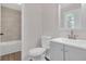 Modern bathroom showcases a stylish vanity, toilet, and a shower-tub with elegant tiling for a clean design at 1143 Cedar Log, Austell, GA 30168