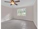 Bedroom with tile floors is bathed in natural light, complemented by a ceiling fan for added comfort at 1143 Cedar Log, Austell, GA 30168