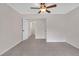 Bedroom features tile floor, neutral walls, and doorway to a laundry room at 1143 Cedar Log, Austell, GA 30168