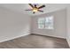 Bright bedroom featuring wood-look floors, ceiling fan and a light-filled window overlooking the landscape at 1143 Cedar Log, Austell, GA 30168