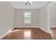 Bright dining room features hardwood floors, neutral walls, modern lighting, and access to other rooms at 1143 Cedar Log, Austell, GA 30168