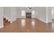 Inviting living room features a cozy fireplace, hardwood floors, a ceiling fan, and a staircase to the upper level at 1143 Cedar Log, Austell, GA 30168