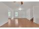 Bright living room featuring hardwood floors, neutral walls, modern lighting, and easy access to other rooms at 1143 Cedar Log, Austell, GA 30168