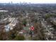 Aerial view of neighborhood with house marked by a red pin and a view of the city skyline at 1486 Akridge Nw St, Atlanta, GA 30314