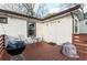 A backyard deck with a grill and small table with two chairs at 1486 Akridge Nw St, Atlanta, GA 30314