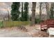 Backyard with deck, bench, and a large, beautiful tree at 1486 Akridge Nw St, Atlanta, GA 30314