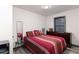 Bright bedroom features stylish bedding, a dresser, and neutral decor at 1486 Akridge Nw St, Atlanta, GA 30314