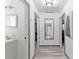 Hallway with grey wood floors and access to bathroom and bedrooms at 1486 Akridge Nw St, Atlanta, GA 30314