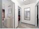 Hallway view to the bathroom, bedroom, and an entry door at 1486 Akridge Nw St, Atlanta, GA 30314