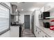 Galley kitchen features stainless appliances, granite counters, and grey accents at 1486 Akridge Nw St, Atlanta, GA 30314