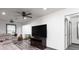 Bright living room offers neutral decor, tv, and wood-look flooring at 1486 Akridge Nw St, Atlanta, GA 30314
