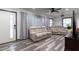 Bright living room features wood-look flooring and plush reclining sofas at 1486 Akridge Nw St, Atlanta, GA 30314