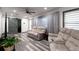 Bright living room features wood-look flooring and plush reclining sofas at 1486 Akridge Nw St, Atlanta, GA 30314