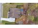 An aerial shot shows the home's roof, deck with hot tub, and surrounding yard and landscaping at 226 Double Gate Ct, Sugar Hill, GA 30518