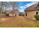 A backyard with storage buildings and a wood privacy fence at 226 Double Gate Ct, Sugar Hill, GA 30518