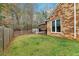 A well-maintained brick home showcasing a beautiful yard and covered deck at 226 Double Gate Ct, Sugar Hill, GA 30518
