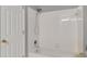Bathroom showcasing a white tiled shower/tub combination at 226 Double Gate Ct, Sugar Hill, GA 30518
