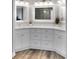 Elegant bathroom featuring dual sinks, quartz countertops, and ample storage space at 226 Double Gate Ct, Sugar Hill, GA 30518