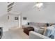 Upstairs bonus room featuring a sectional sofa with pillows and an ottoman at 226 Double Gate Ct, Sugar Hill, GA 30518