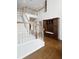 Grand foyer with staircase, hardwood floors, and built-in storage at 226 Double Gate Ct, Sugar Hill, GA 30518