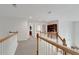 Upstairs hallway with neutral paint and carpet at 226 Double Gate Ct, Sugar Hill, GA 30518