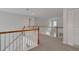 Upstairs hallway with natural light and closet space at 226 Double Gate Ct, Sugar Hill, GA 30518