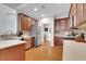 Well-lit kitchen with stainless steel appliances, wood cabinets, and ample counter space at 226 Double Gate Ct, Sugar Hill, GA 30518