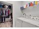 Convenient laundry room with washer, dryer, and closet for storage at 226 Double Gate Ct, Sugar Hill, GA 30518