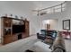 Spacious living room with a large television and a comfortable sectional sofa, great for relaxing at 226 Double Gate Ct, Sugar Hill, GA 30518